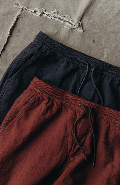editorial flatlay of The Apres Pant in Burgundy Double Cloth