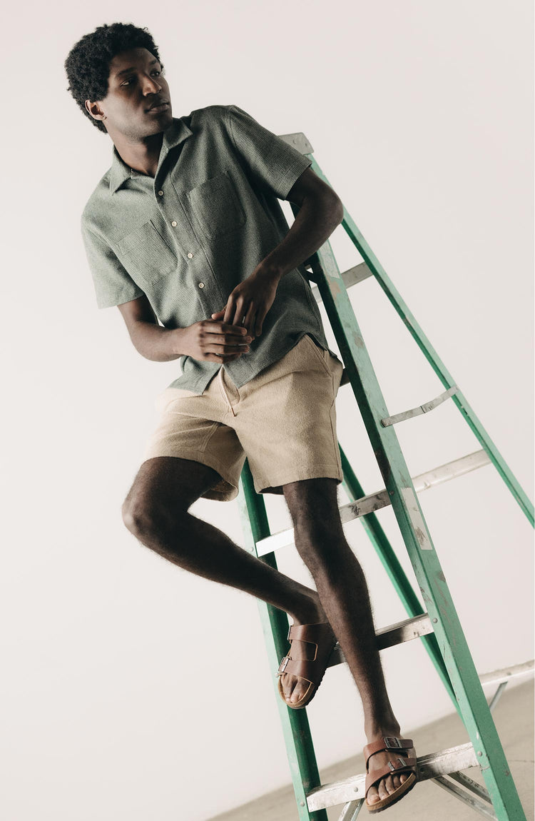 fit model posing in The Apres Short in Heather Oat Crepe