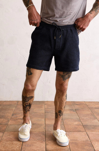 Our model standing in The Apres Short in Indigo Waffle