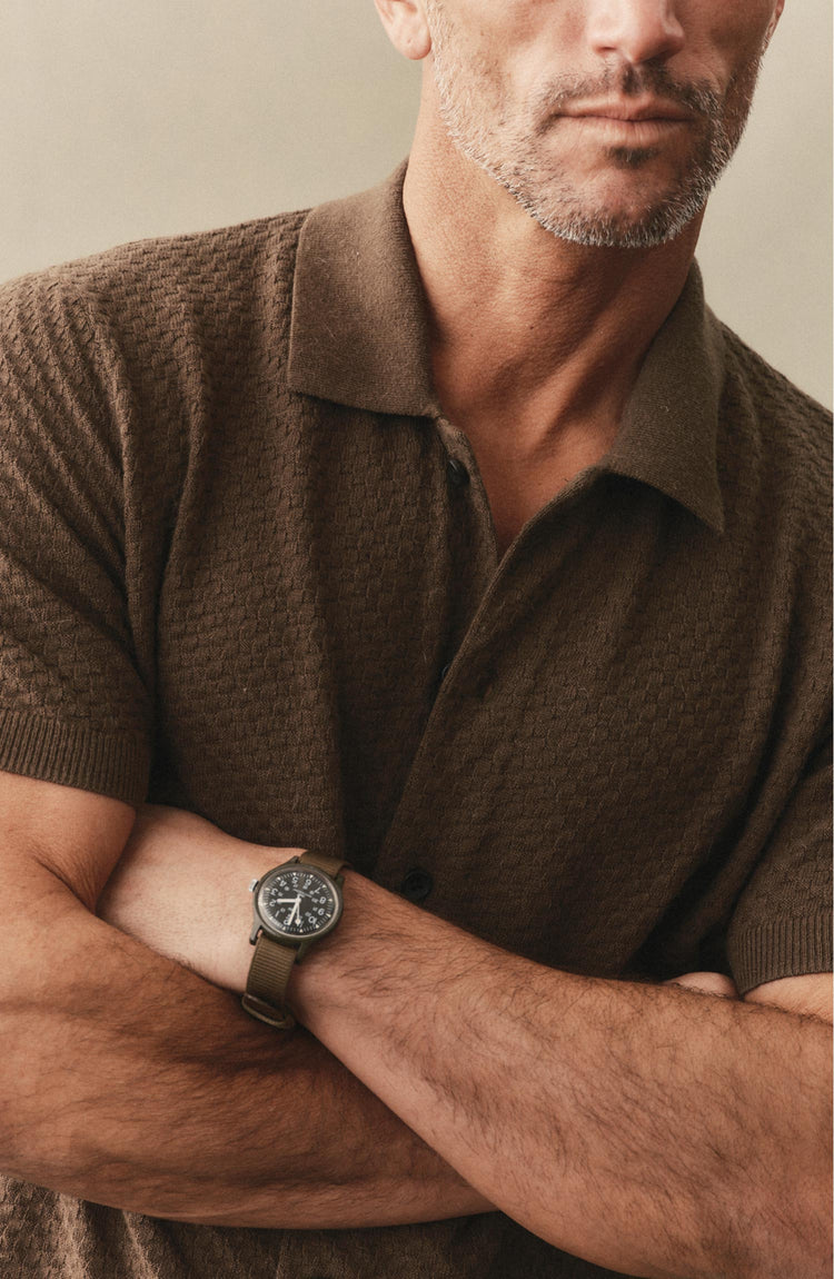 fit model posing in The Arlo Sweater Polo in Cilantro Texture Knit