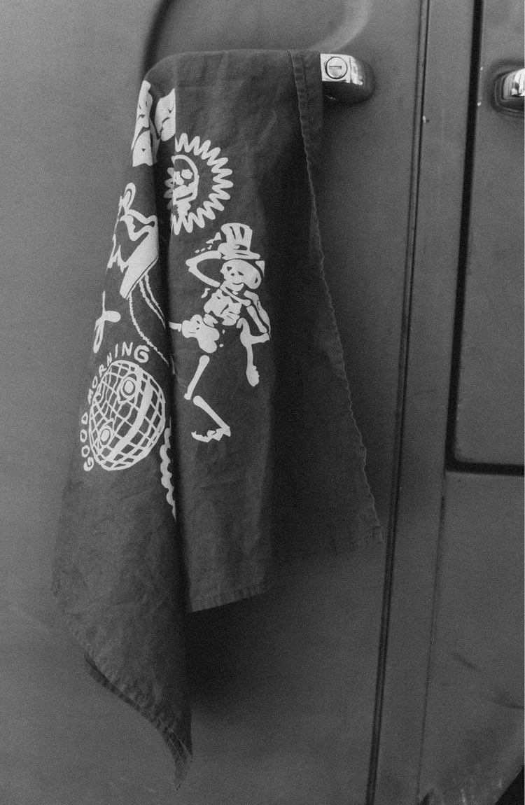 editorial image of The Bandana in Faded Black Stamp hanging on a car door