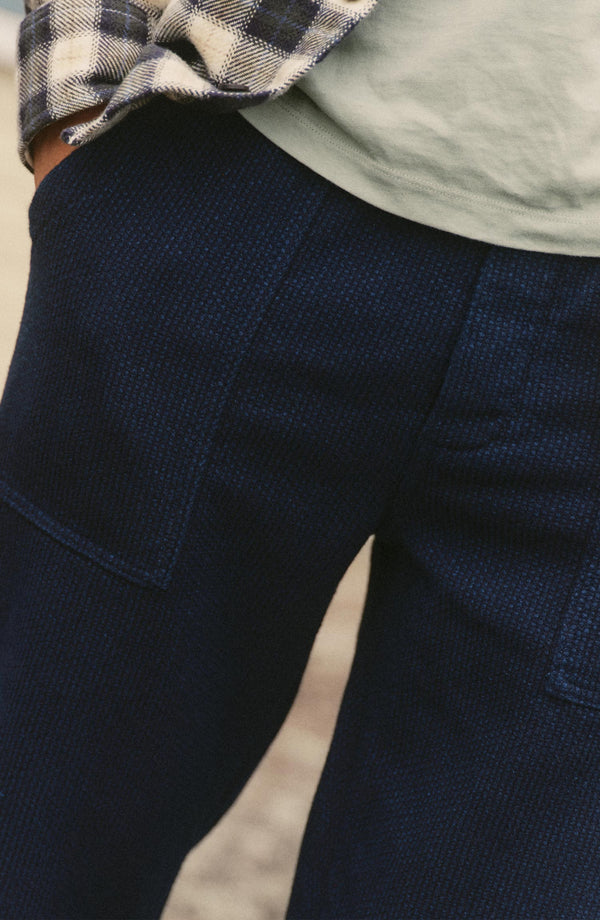 fit model showing off the pocket on The Breakwater Pant in Rinsed Indigo Sashiko