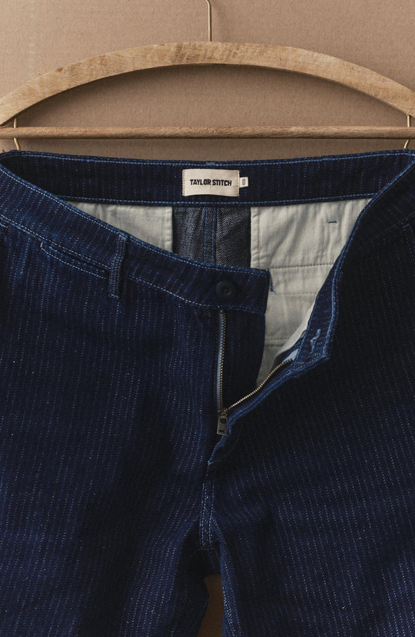 editorial image of The Camden Pant in Rinsed Indigo Roped Denim hanging