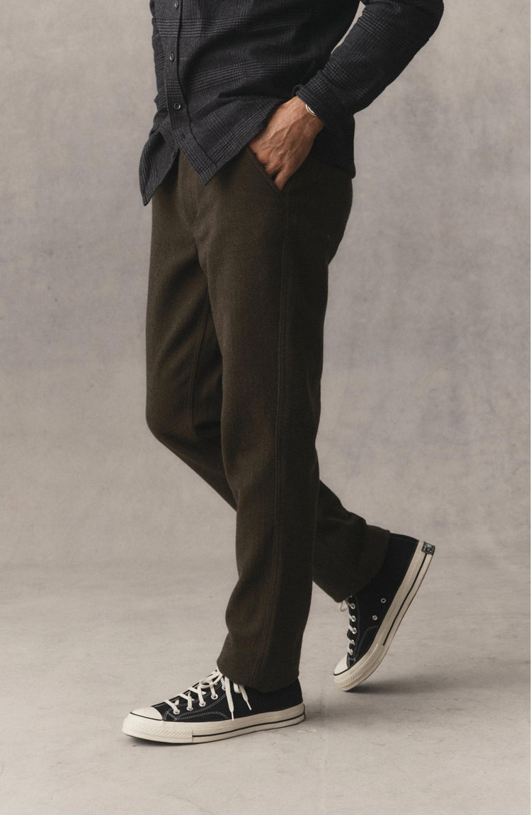 fit model standing wearing The Carnegie Pant in Army Herringbone Wool