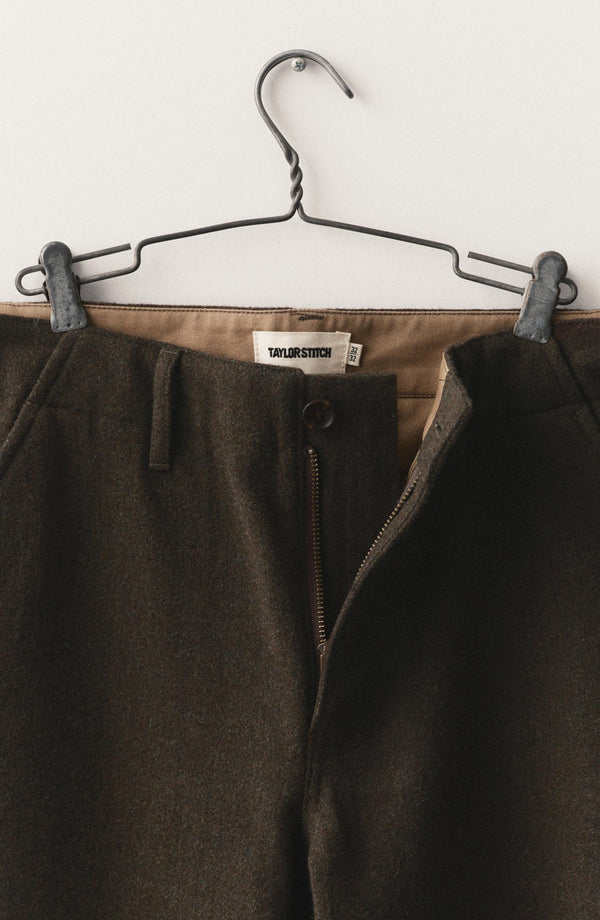 fit model with his hand in the pocket of The Carnegie Pant in Army Herringbone Wool