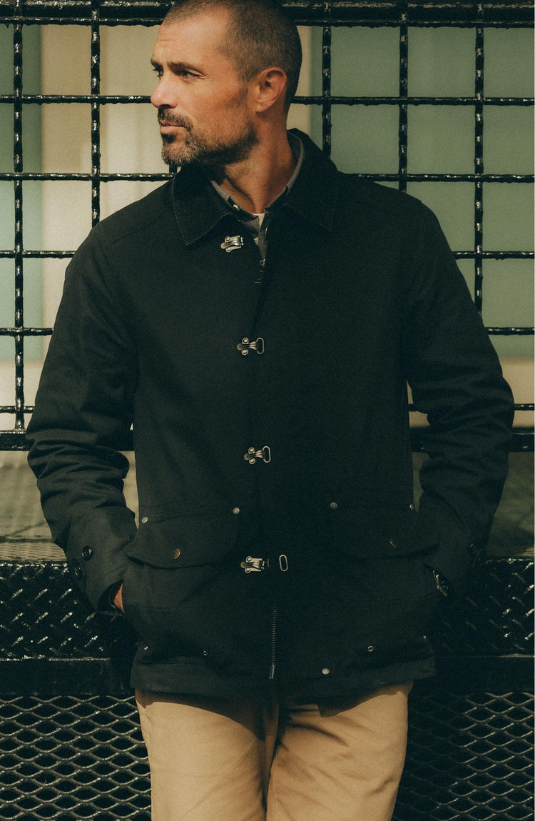 fit model posing in The Cinder Jacket in Coal Dry Wax