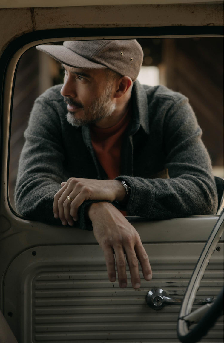 fit model posing in The Connor Overshirt in Heather Olive Boucle