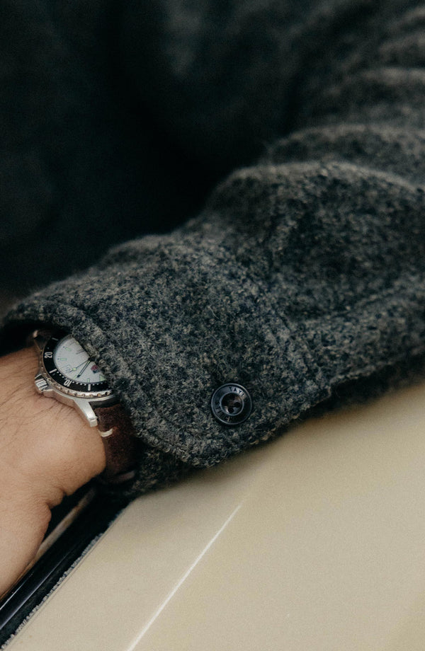 fit model showing off the sleeves on The Connor Overshirt in Heather Olive Boucle