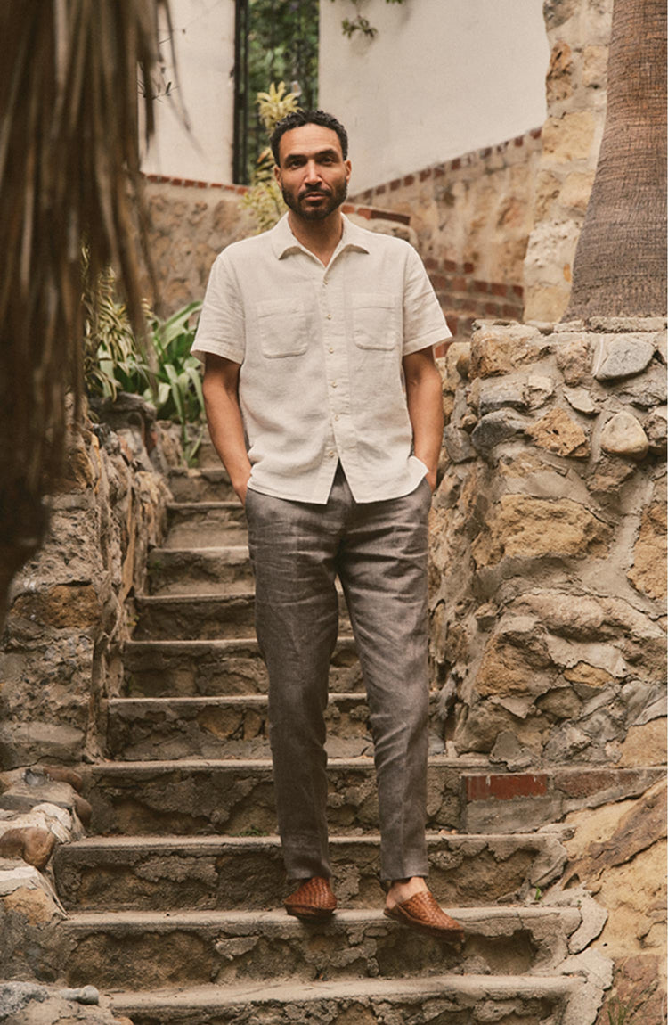 fit model posing in The Conrad Shirt in Vintage White Linen