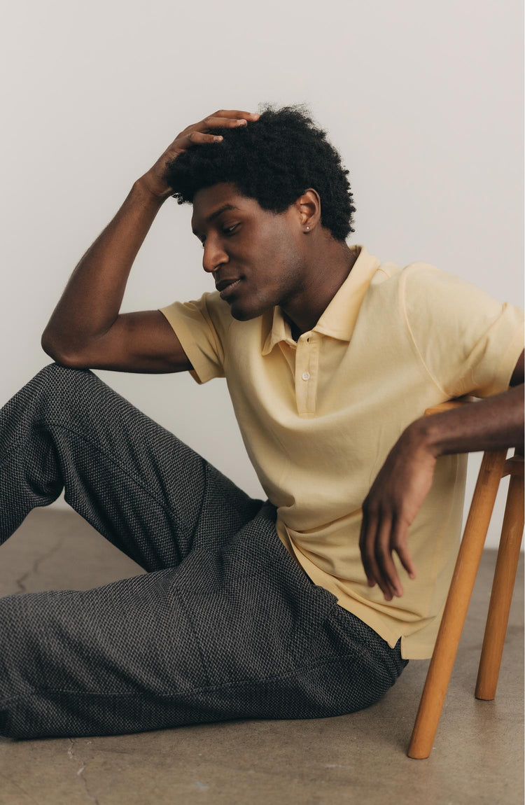 fit model posing in The Cotton Hemp Polo in Straw Pique