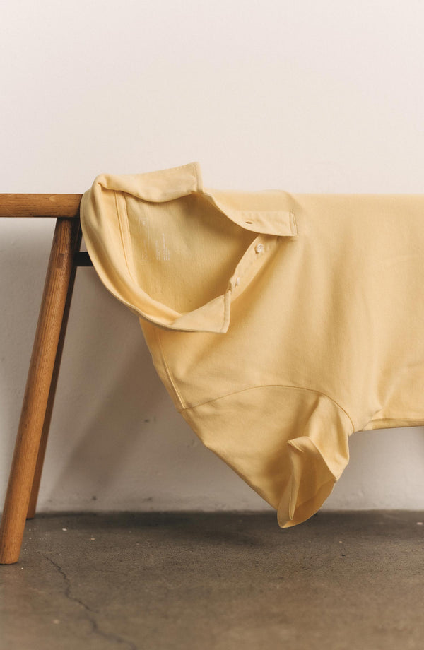 editorial image of The Cotton Hemp Polo in Straw Pique on a bench