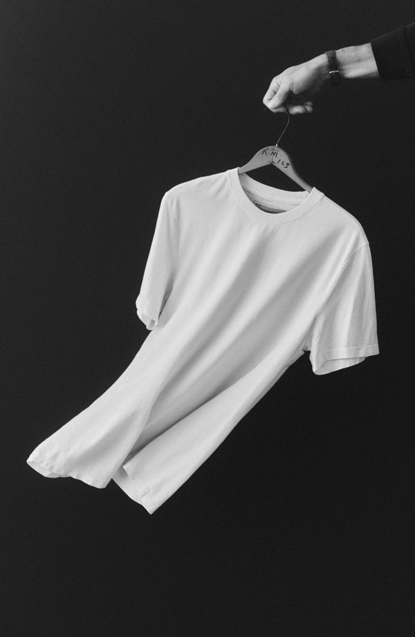 editorial image of The Cotton Hemp Tee in Vintage White hanging