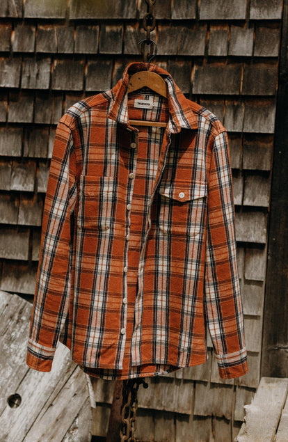 editorial image of The Crater Shirt in Brick Plaid hanging