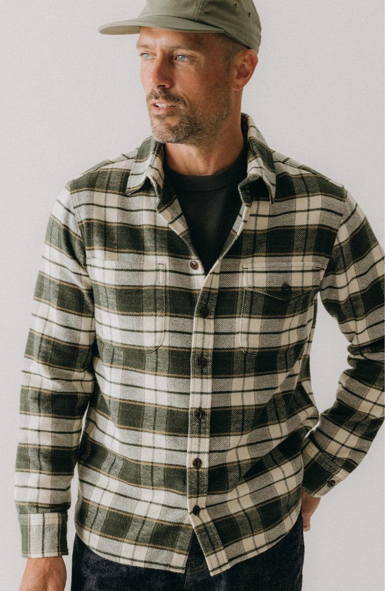 fit model posing in The Crater Shirt in Forest Plaid