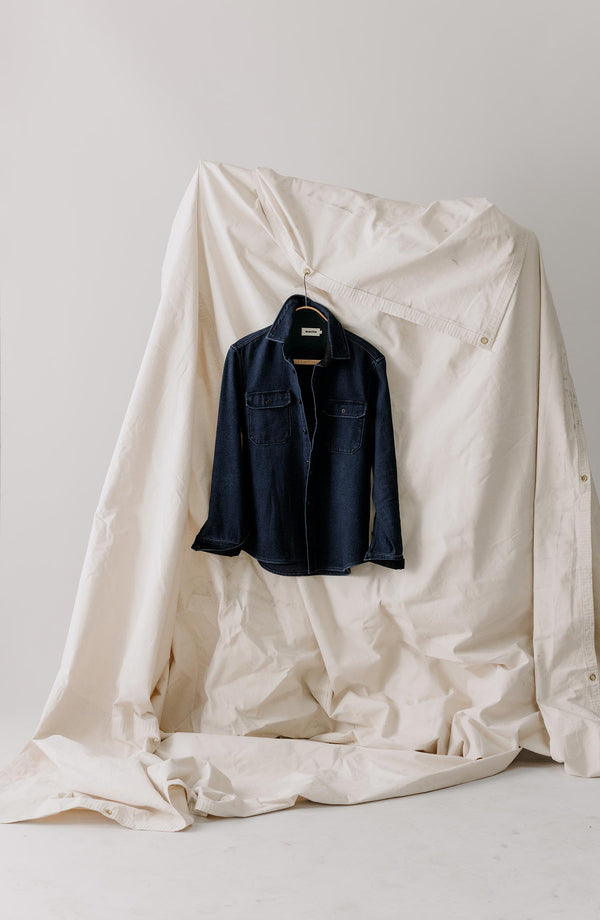 editorial image of The Division Shirt in Rinsed Indigo hanging