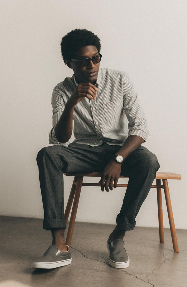 fit model showing off The Easy Pant in Black Indigo Chambray