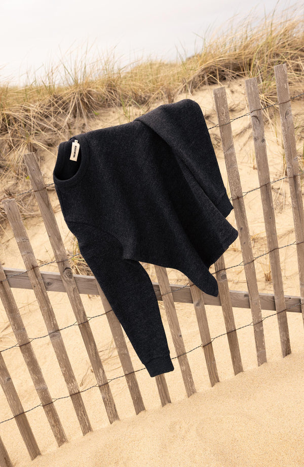 editorial image of The Evans Crew in Navy Birdseye Wool on a fence