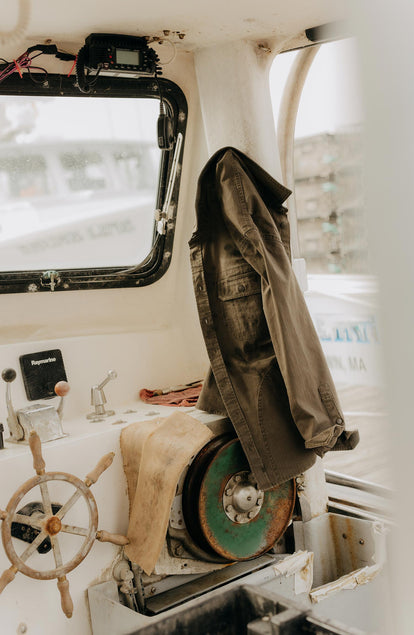 editorial image of The Field Overshirt in Mushroom Ripstop in a boat
