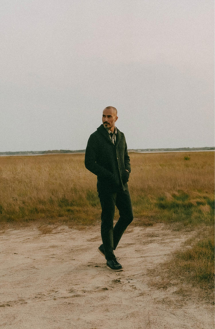 fit model posing in The Fisherman Shawl Cardigan in Heather Coal Merino