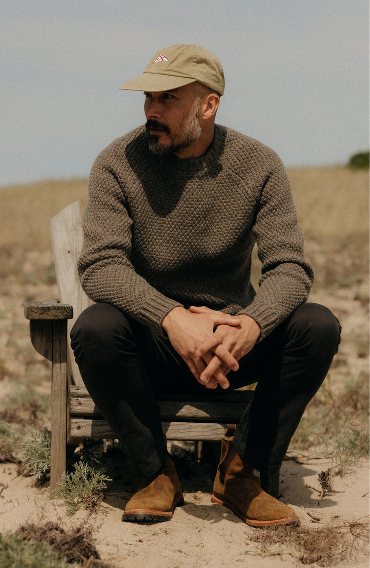 fit model posing in The Fisherman Sweater in Taupe Merino
