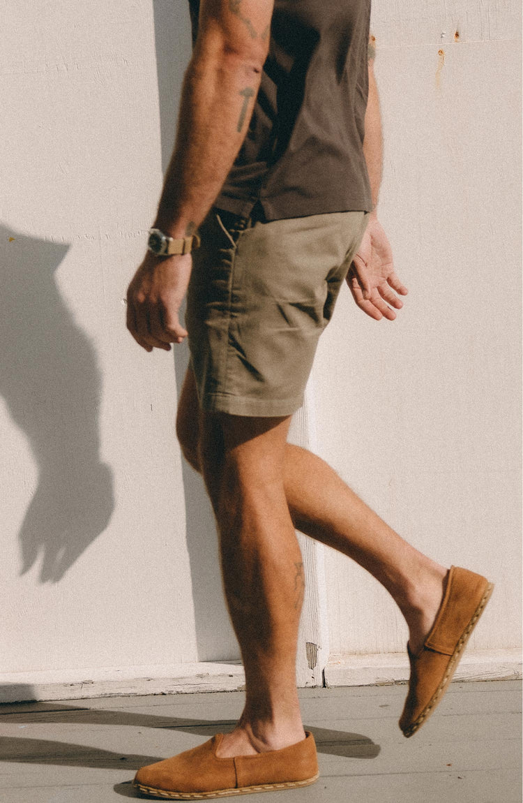 fit model walking wearing The Foundation Short in Organic Smoked Olive