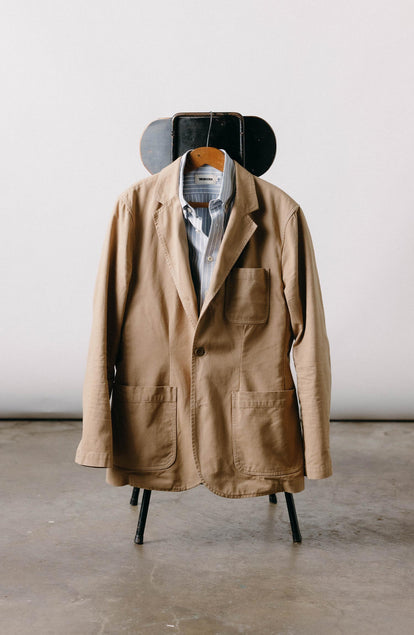 editorial image of The Foundation Sportcoat in Organic Khaki Twill hanging on a chair