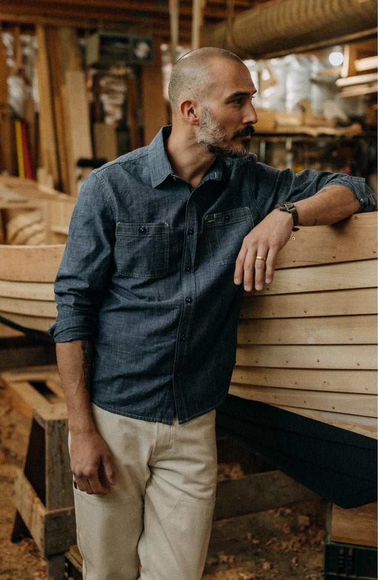fit model posing in The Foundry Shirt in Rinsed Indigo Chambray