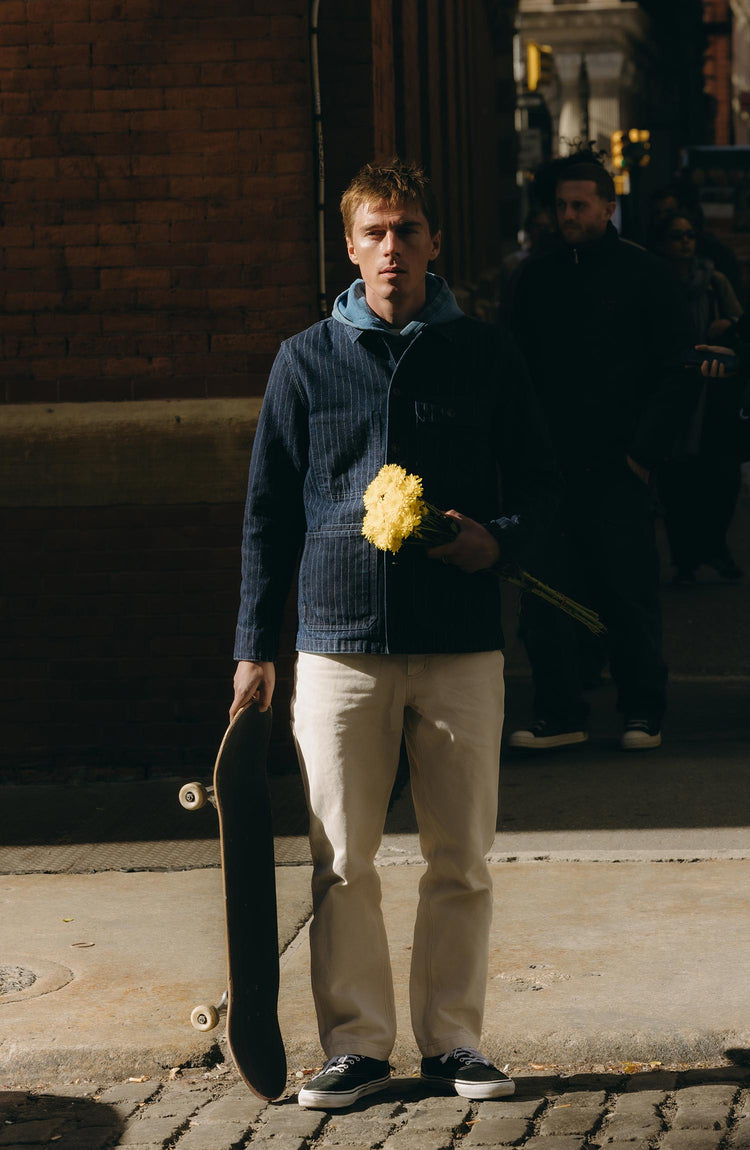 fit model posing in The Fremont Jacket in Rinsed Indigo Dobby Denim