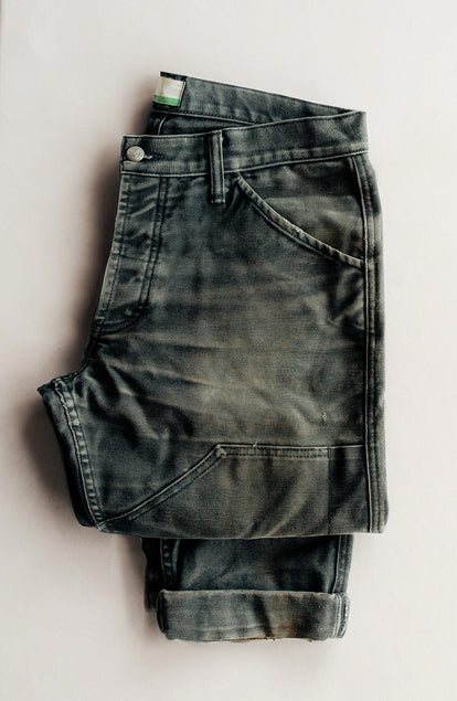 folded flatlay of old The Good Acre Chore Pant in Black Canvas
