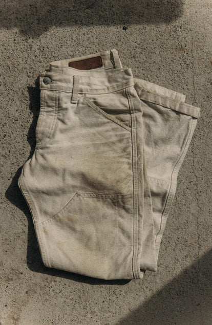 folded flatlay of The Good Acre Chore Pant in Natural Canvas