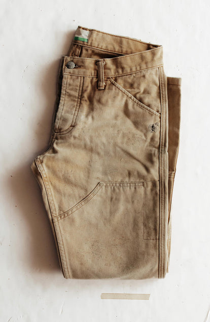 folded flatlay of The Good Acre Chore Pant in Tan Canvas