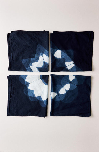editorial image of The Hand Dyed Bandana in Indigo Sunflower next to other bandanas