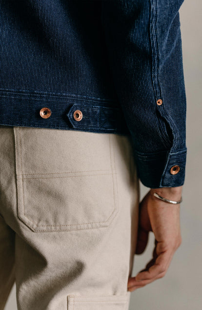Our model standing in the long haul jacket in indigo waffle