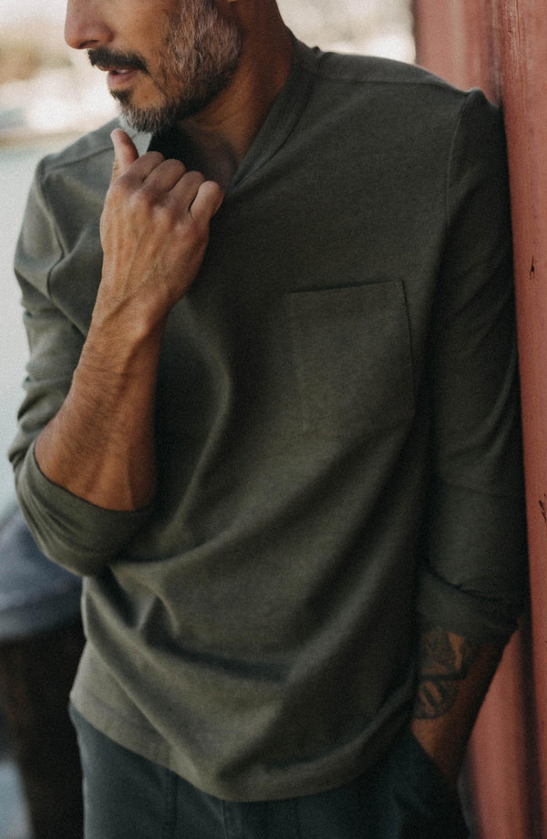 fit model showing off The Long Sleeve Shop Tee in Army Twist