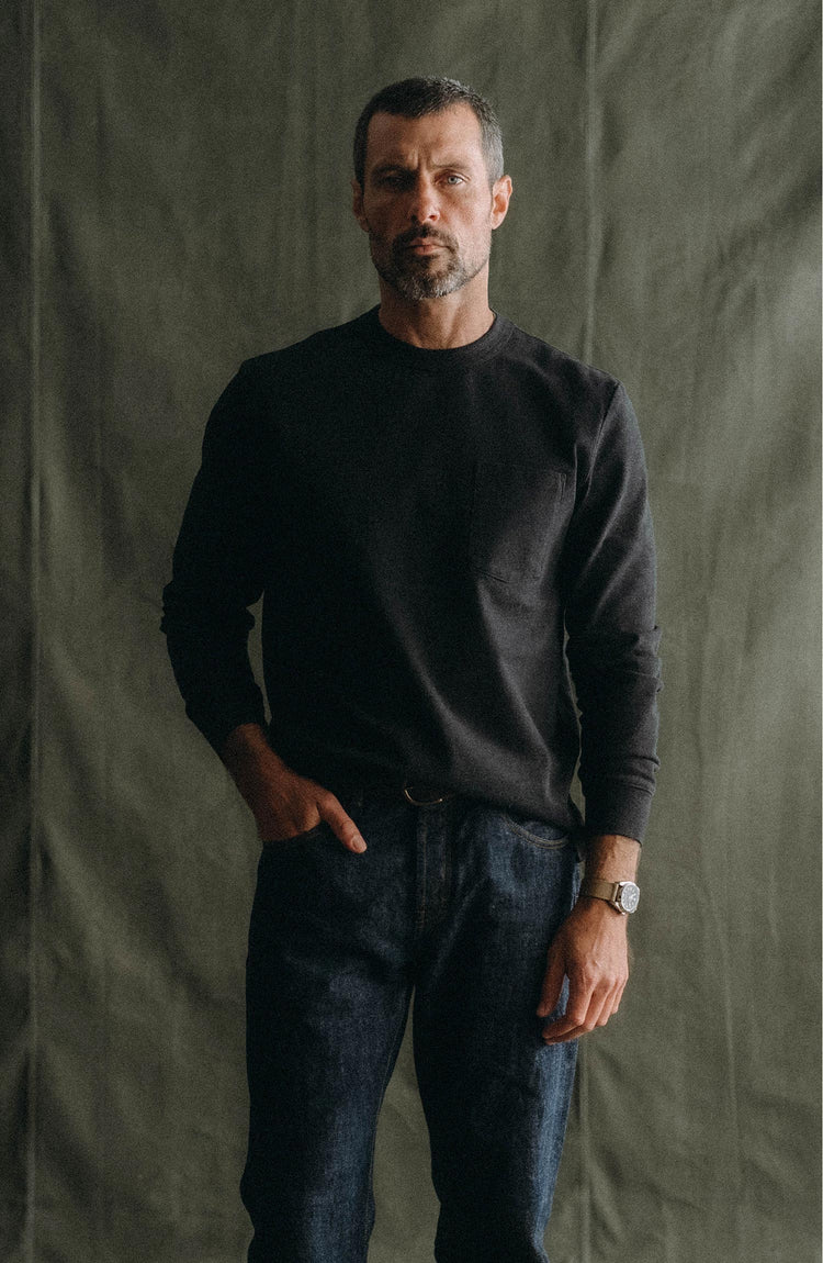 fit model posing in The Long Sleeve Shop Tee in Coal Twist