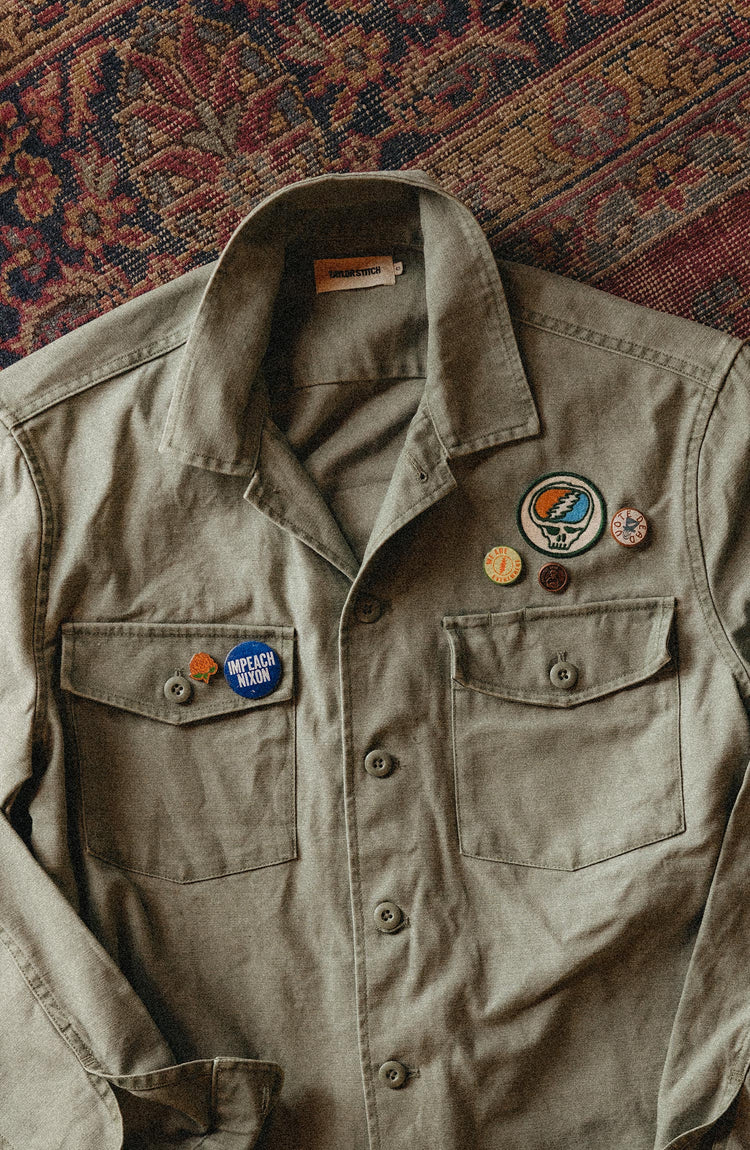 editorial image of the pins on a jacket for The Magoo’s Pin Set