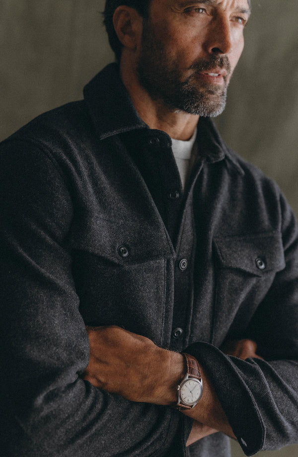 fit model with his arms crossed wearing The Maritime Shirt Jacket in Heather Charcoal Wool