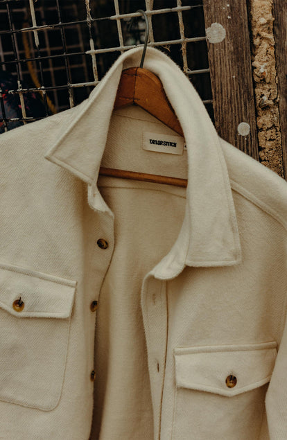 editorial image of The Maritime Shirt Jacket in Vintage White Moleskin Twill hanging