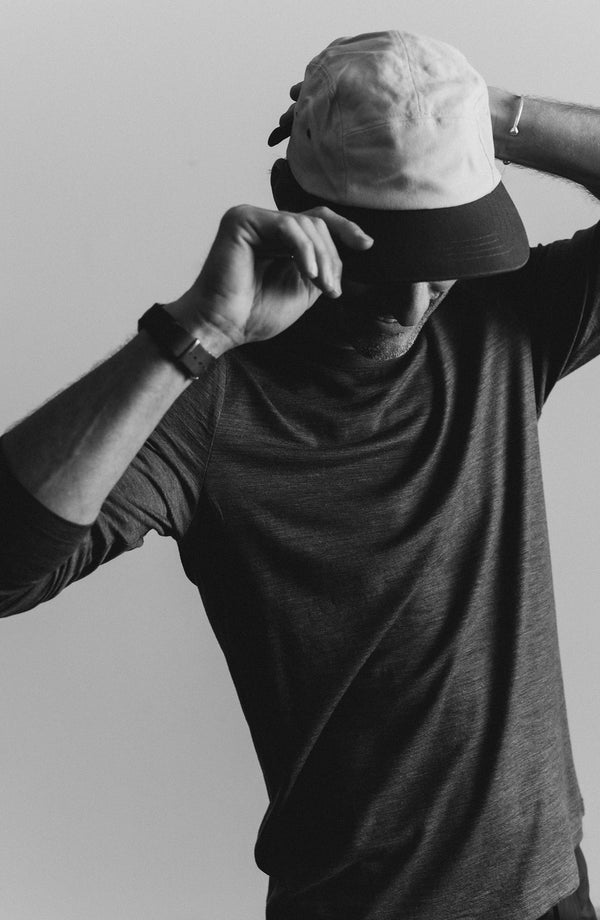 fit model posing in The Merino Long Sleeve Tee in Heather Army