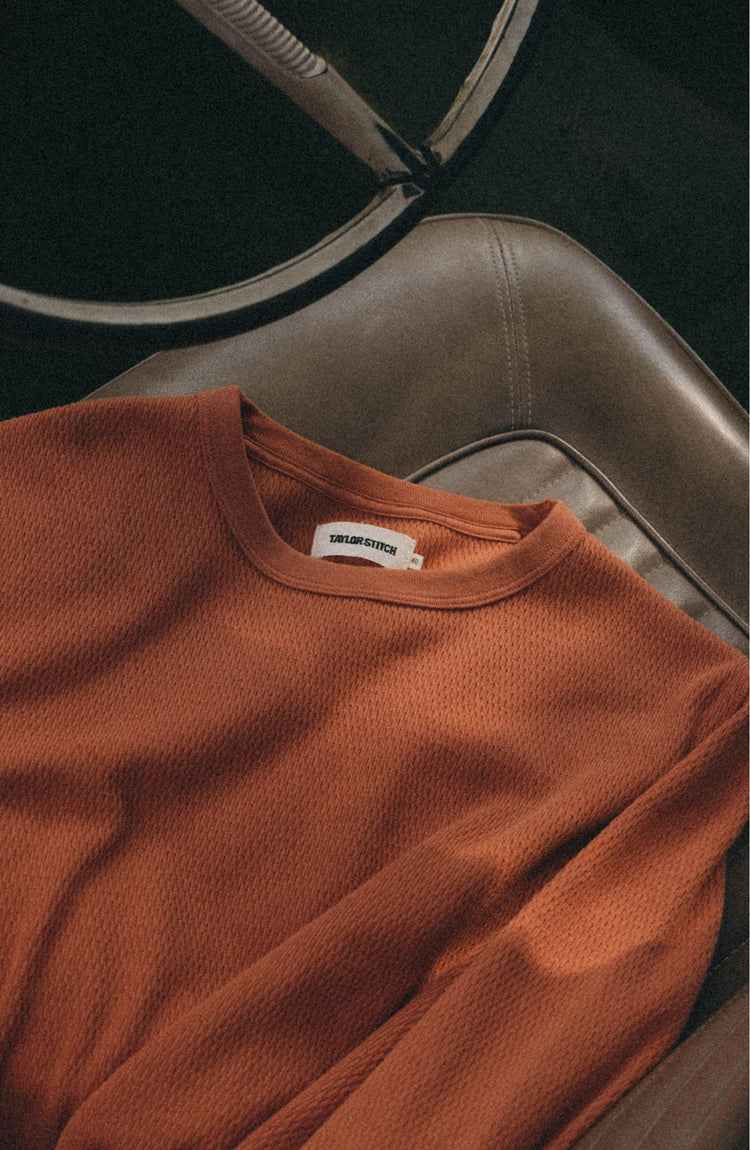 editorial flatlay of The Organic Cotton Crew in Summit Orange Waffle