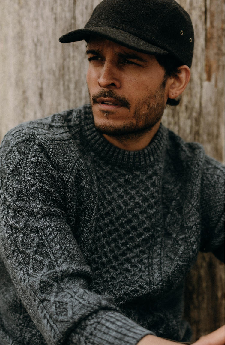 fit model posing in The Orr Sweater in Marled Marine Merino