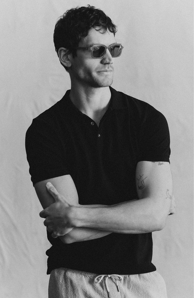 fit model posing in The Pacific Polo in Black Indigo Pique