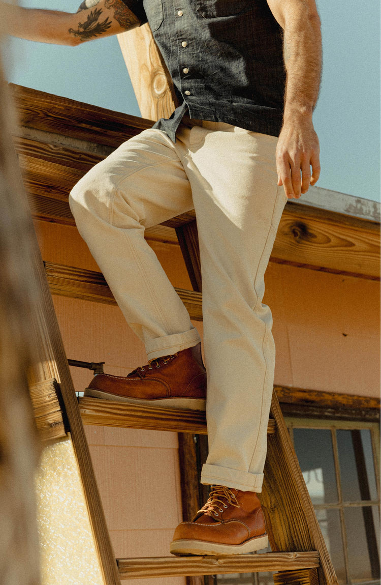fit model posing in The Painter Pant in Seeded Natural Chipped Canvas