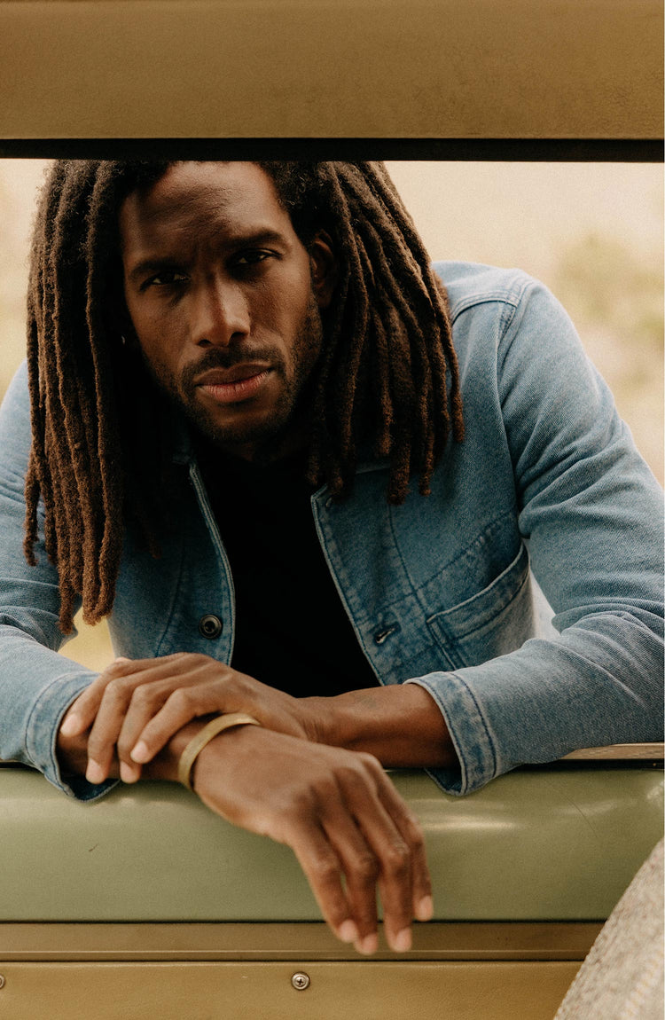 fit model posing in The Primer Jacket in Washed Indigo Terry