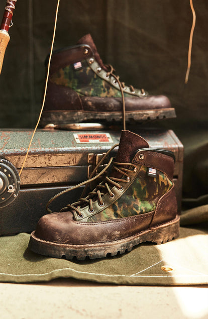 editorial image of The Ridge Boot in Painted Camo on a toolbox