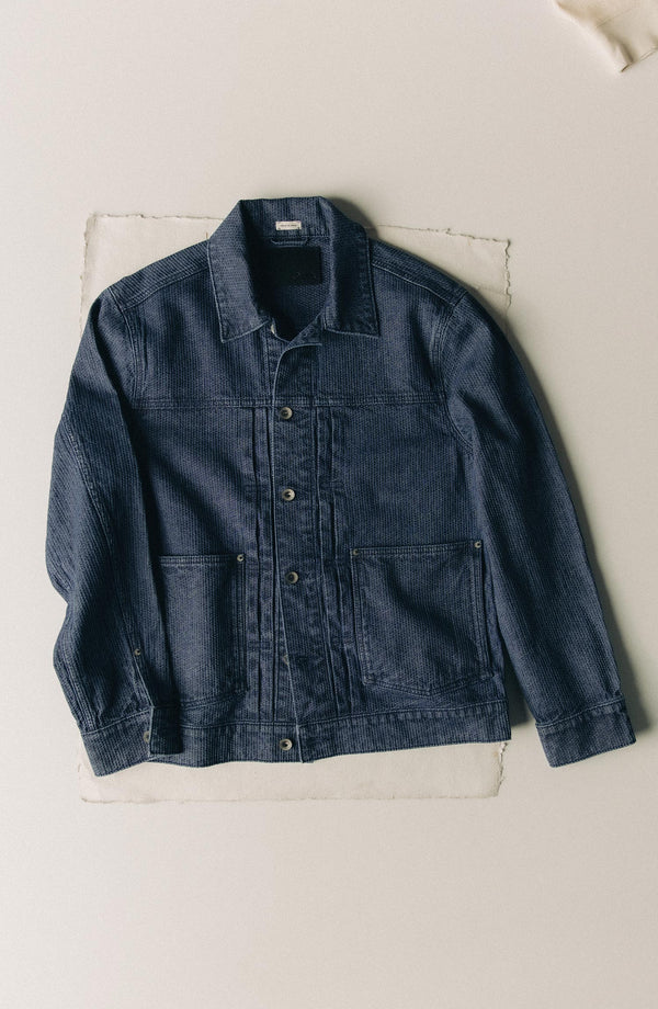 editorial flatlay of The Ryder Jacket in Japanese Washed Indigo Sashiko