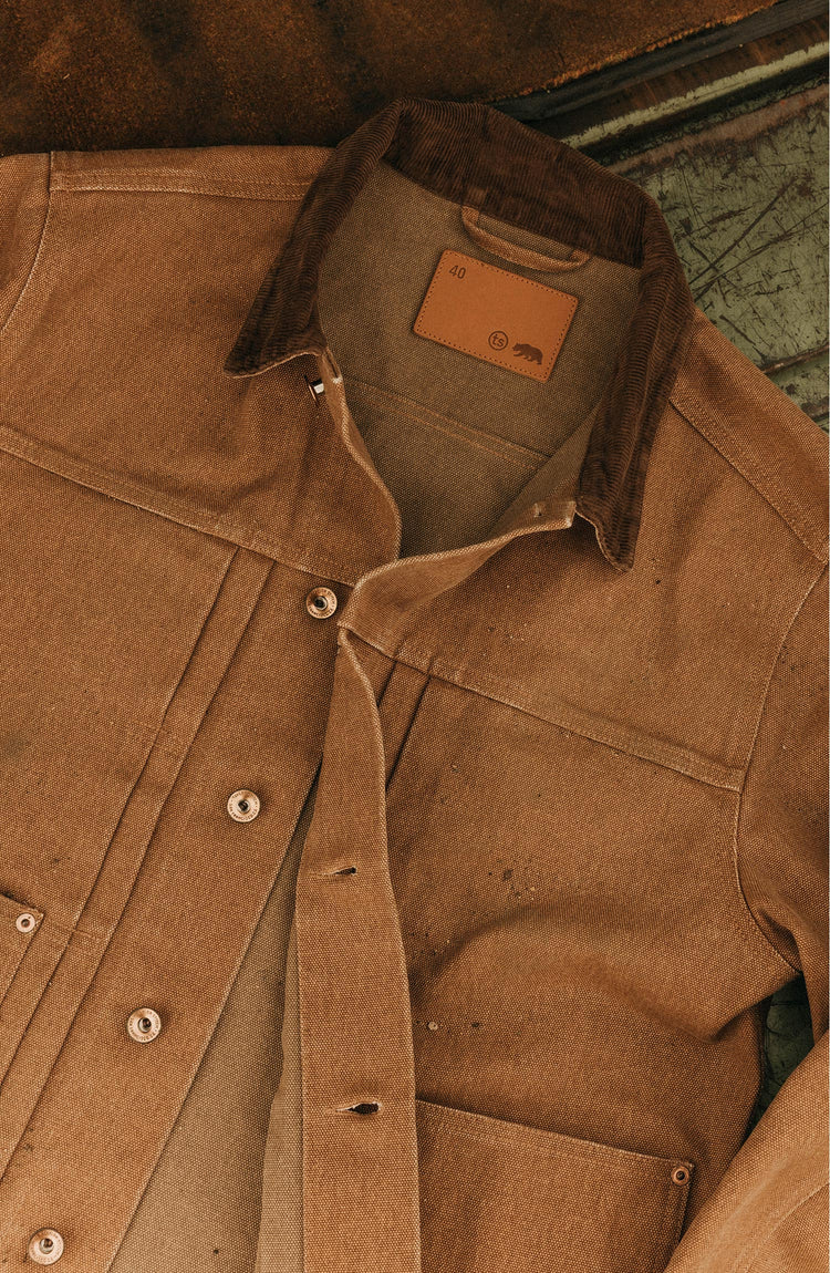 fit model walking in The Ryder Jacket in Tobacco Chipped Canvas