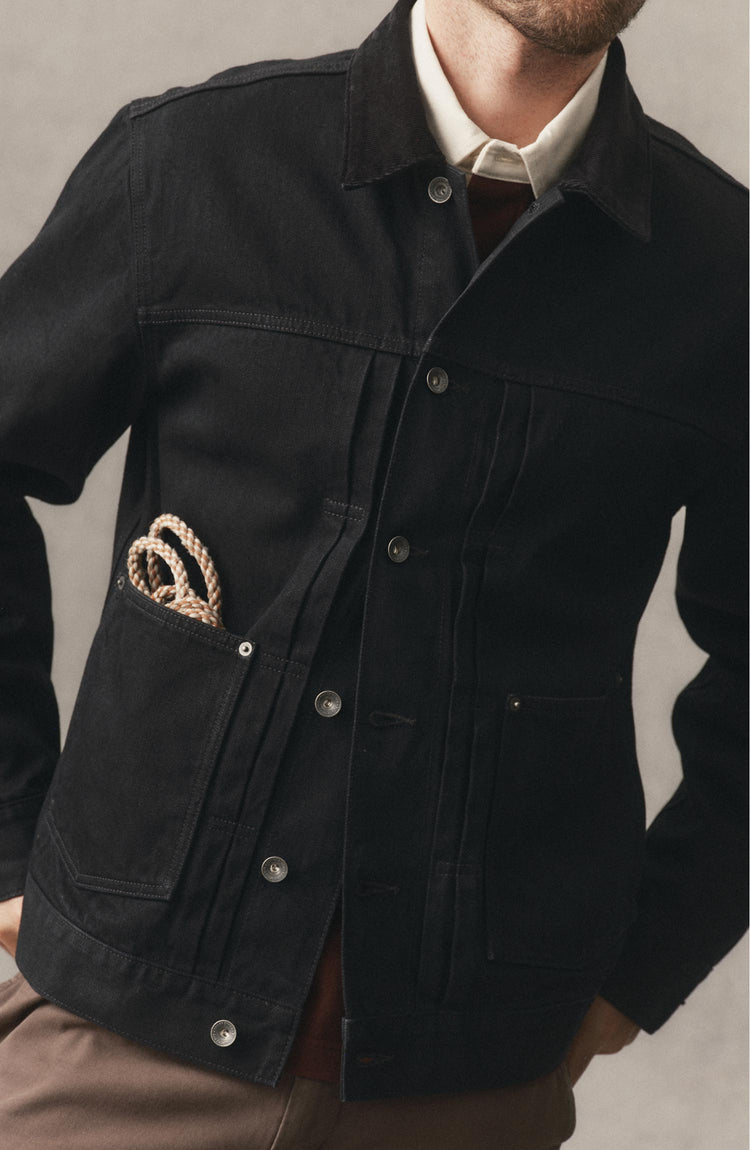 fit model posing in The Ryder Jacket in Rinsed Black Organic Selvedge