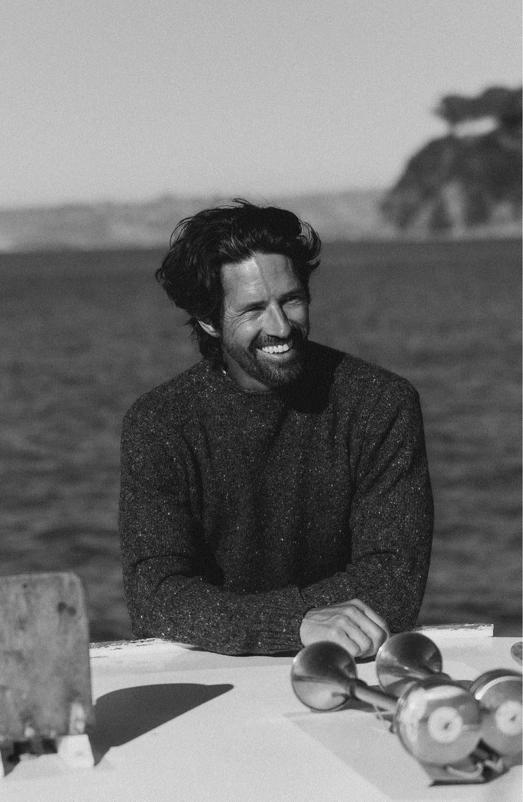 fit model posing in The Seafarer Sweater in Charcoal Donegal