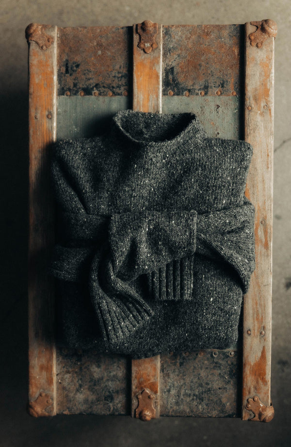 folded flatlay of The Seafarer Sweater in Charcoal Donegal